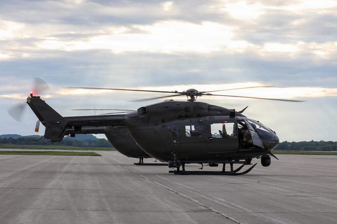 Sun rays shine down on a U.S. Army UH-72 Lakota, belonging to the Kentucky National Guard, as it sits ready for a simulated surveillance mission at Volk Field Combat Readiness Training Center (CRTC), Wisconsin, during Patriot 26, Aug. 25, 2026.