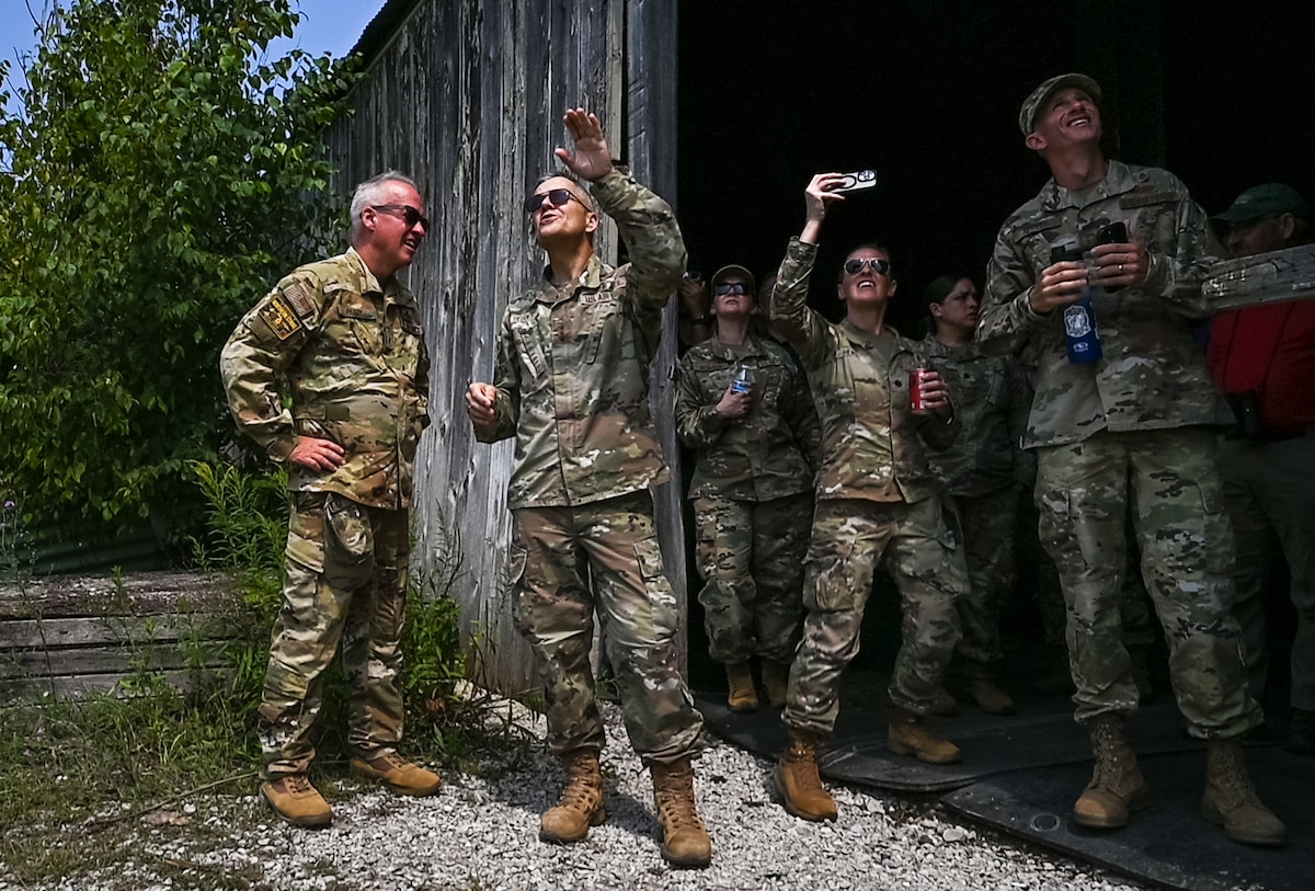 Image of Airmen looking into the sky during a training