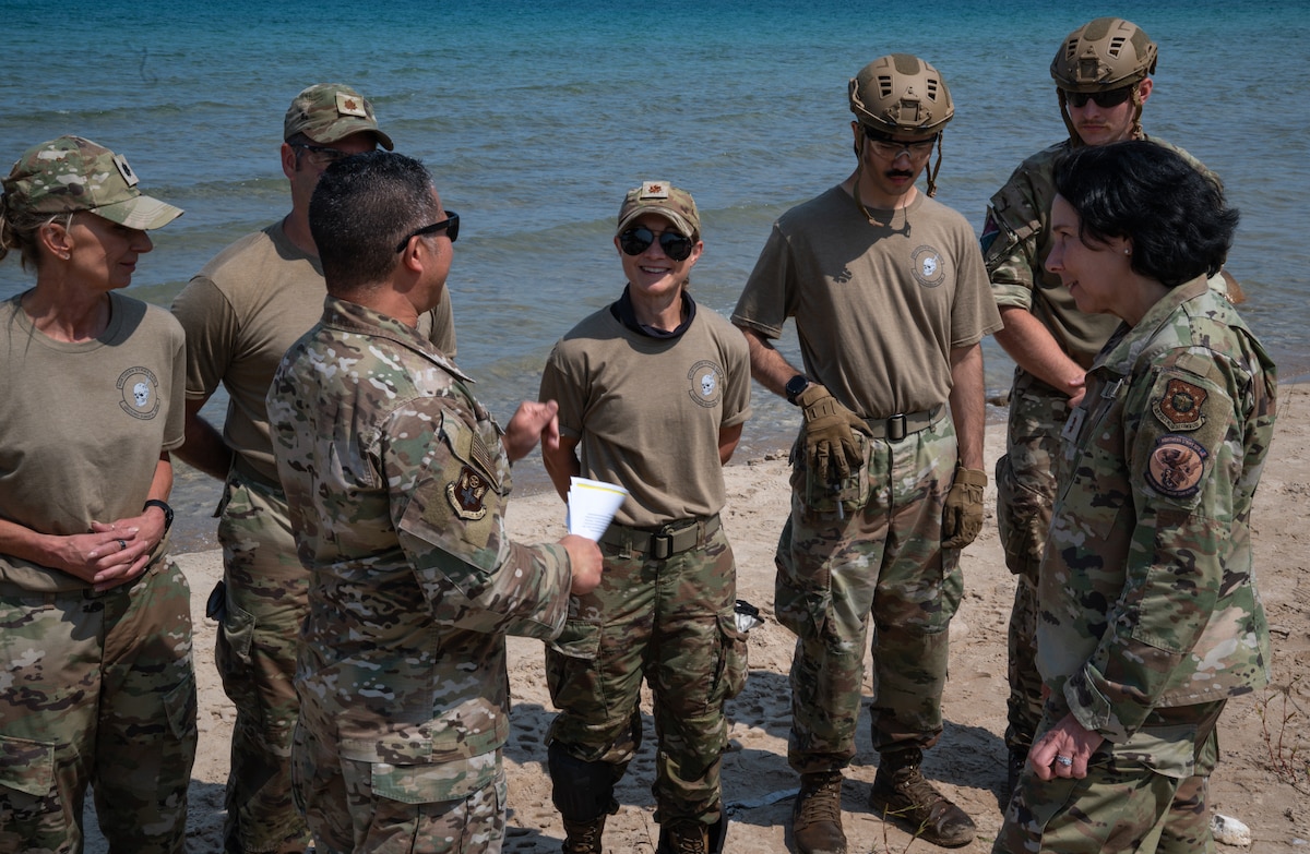 A group of Airmen training and talking.