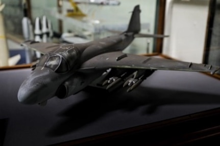 A soot-covered model of an A-6 Intruder recovered from the Pentagon following the Sept. 11, 2001, terrorist attack is preserved by the Department of the Navy Ship Model Program at Naval Surface Warfare Center, Carderock Division.