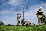 Airmen assigned to the 155th Communications Squadron adjust VHF and UHF radio antennas during a disaster response exercise in Yutan, Nebraska, Sept. 2, 2026. The antennas support a cross-band communications system that allows radios from different teams and responding agencies to communicate with one another, helping establish an interoperable communications network during large-scale emergency response operations. Photo by Master Sgt. Jessica Kind.