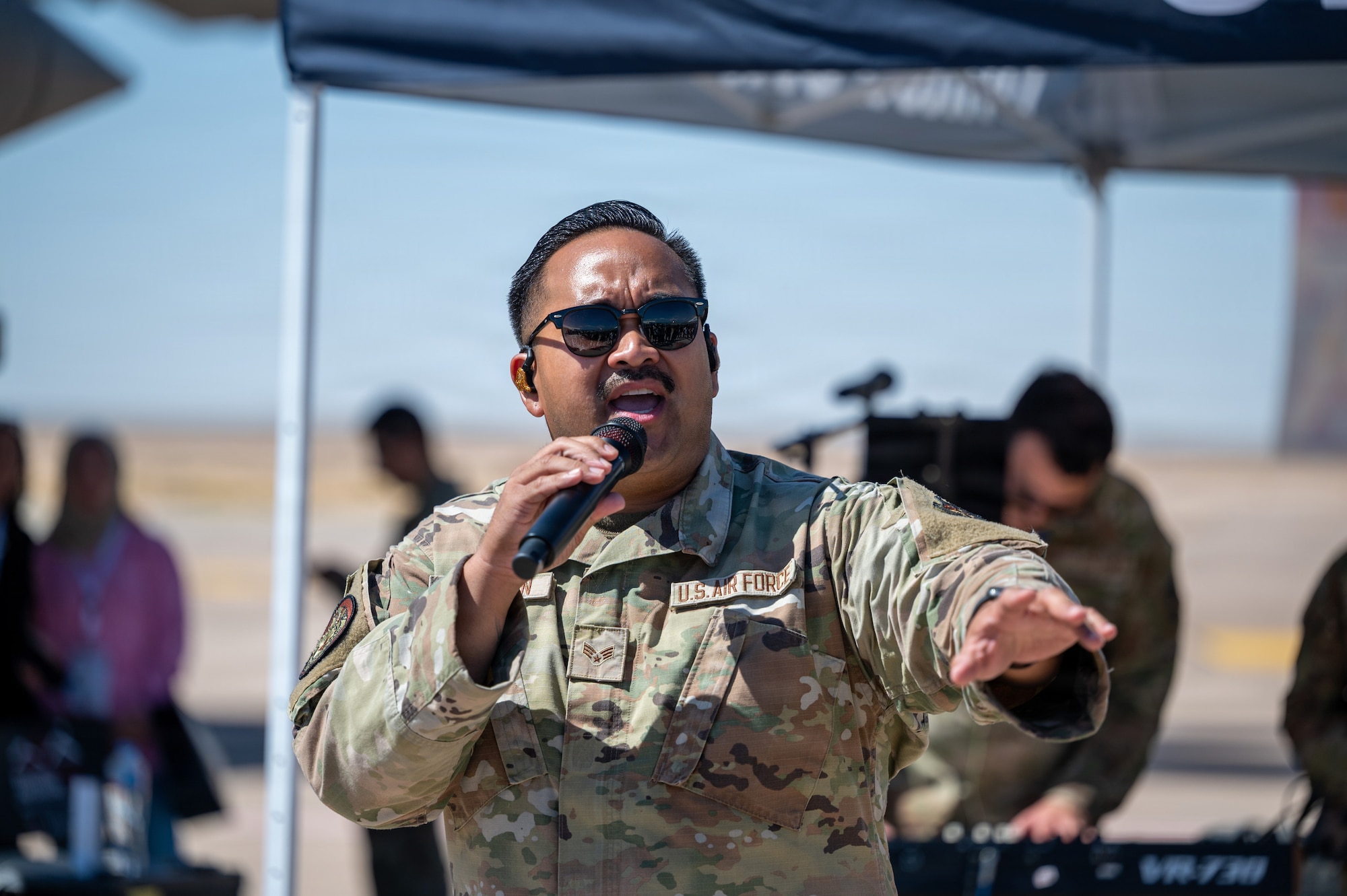 A person performs a song during an airshow