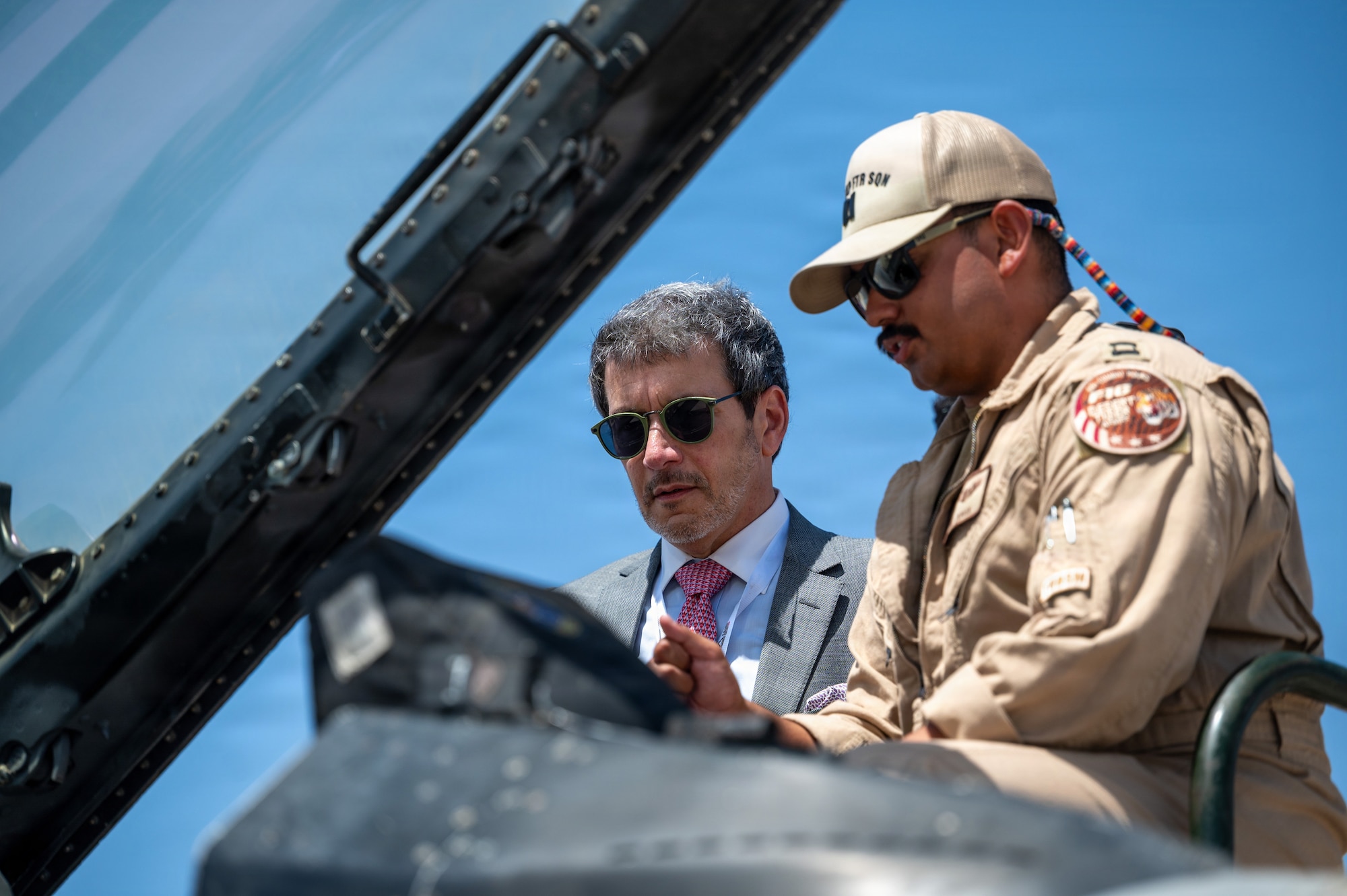People look at an aircraft cockpit