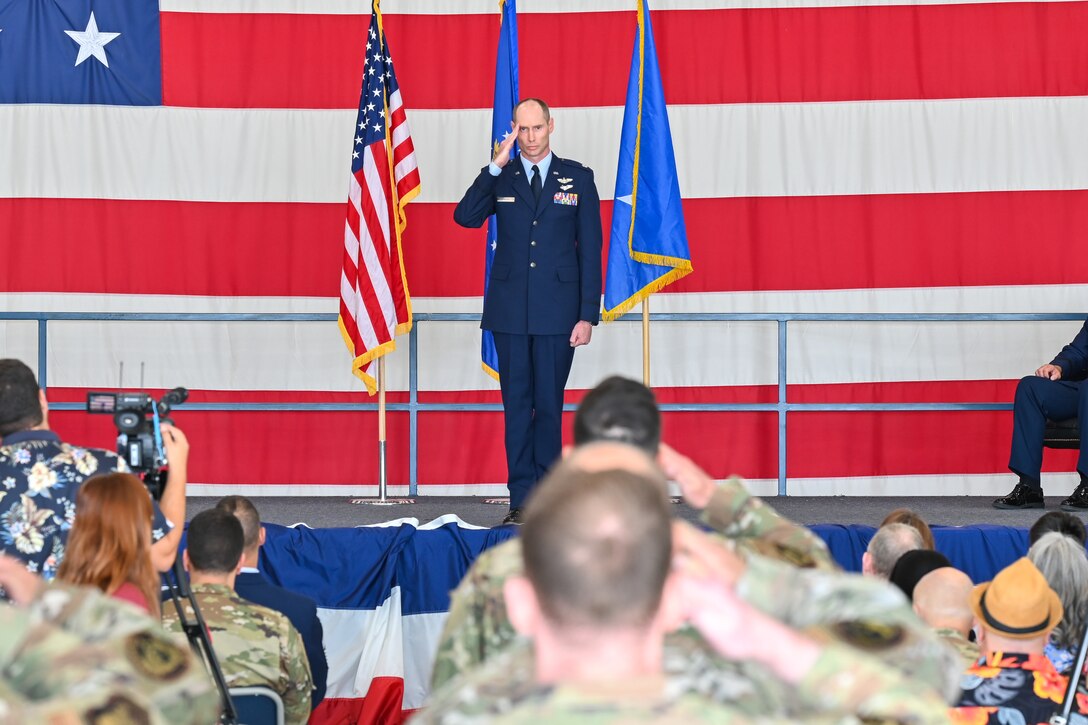 U.S. Air Force Lt. Col. Joshua Dawkins, B-21 Integration Detachment 1 commander, receives his first salute