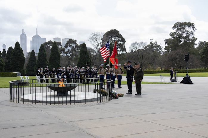 U.S. Marine Corps Col. George Flynn, the commanding officer of Marine Rotational Force – Darwin 26, and a Royal Australian Air Force officer salute after laying wreaths before the Eternal Flame during a 9/11 memorial service at the Shrine of Remembrance in Melbourne, Australia, Sept. 10, 2026.
