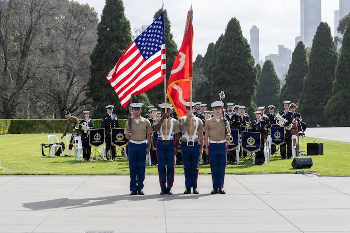 From right to left, U.S. Marine Corps Cpl. Harley Grim, an aviation maintenance database specialist, Sgt. Noah Johnson and Lance Cpl. Kai Pua, both aircrew chiefs, and Sgt. Zedrick Sherman, a mobility logistics chief, all with Marine Medium Tiltrotor Squadron (VMM) 268 Reinforced (Rein.), Marine Rotational Force – Darwin 26, present the colors during a 9/11 memorial service at the Shrine of Remembrance in Melbourne, Australia, Sept. 10, 2026.