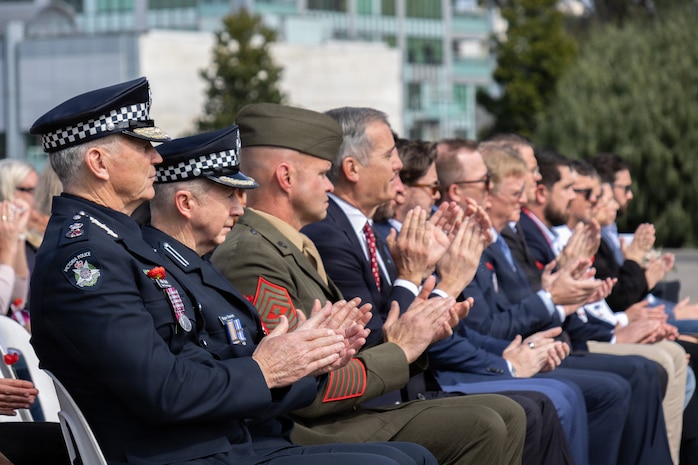 U.S. Marine Corps Sgt. Maj. Anthony Lappe, the sergeant major of Marine Rotational Force – Darwin 26, and attendees clap during a 9/11 memorial service at the Shrine of Remembrance in Melbourne, Australia, Sept. 10, 2026.