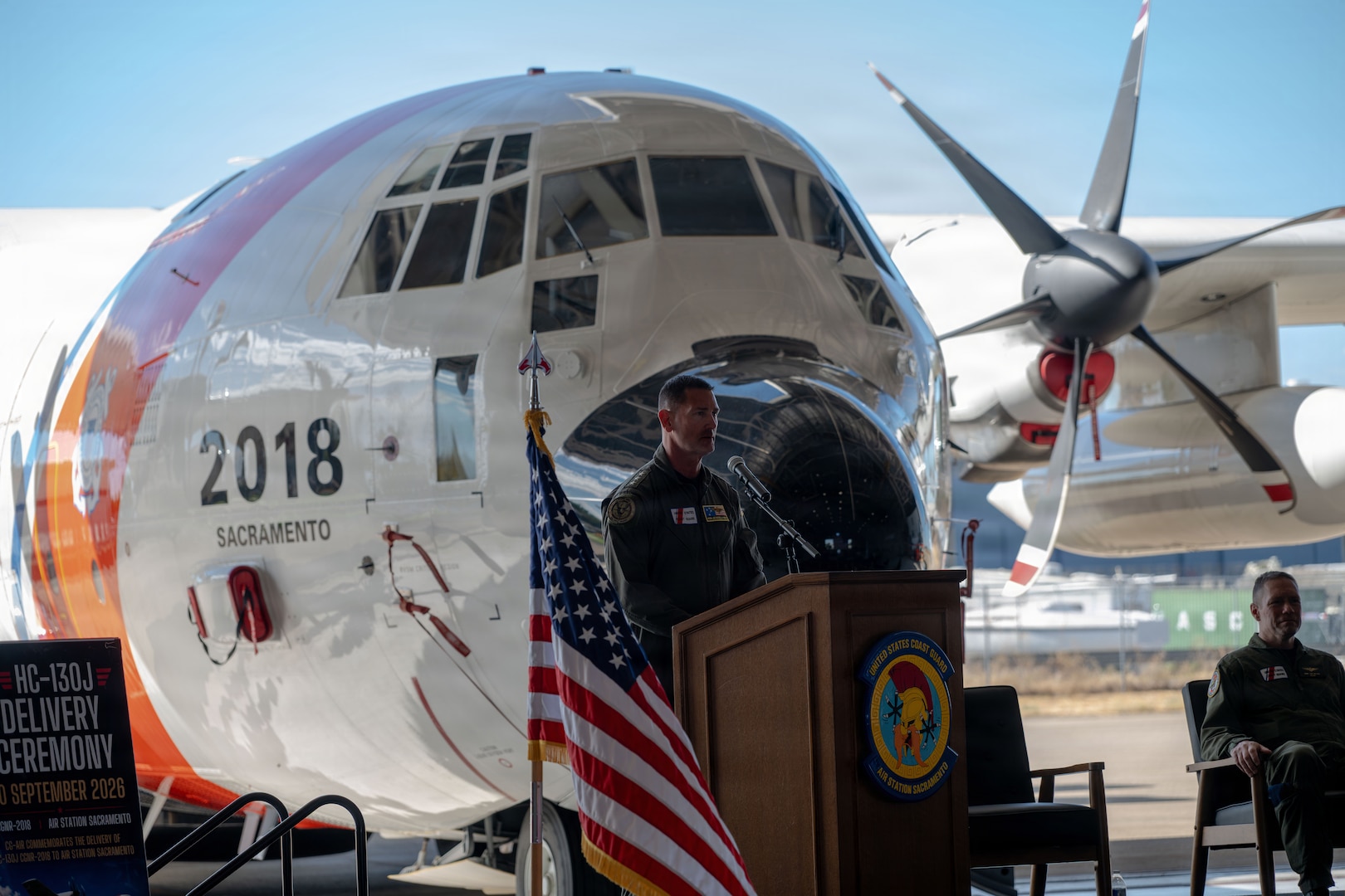 Vice Adm. Joseph R. Buzzella, commander, Coast Guard Pacific Area, presides over a delivery ceremony at Air Station Sacramento in McClellan Park, California, Sept. 10, 2026. The Coast Guard commemorated the delivery of the first HC-130J Super Hercules aircraft to Air Station Sacramento. (U.S. Coast Guard photo by Petty Officer 3rd Class Joel LaVallee)