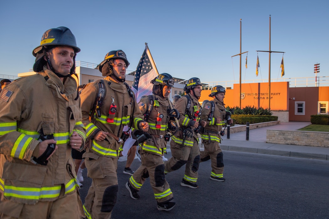 Personnel assigned to Naval Support Activity Souda Bay run in full bunker gear during a 9/11 Remembrance Run onboard NSA Souda Bay, Greece, Sept. 11, 2026.