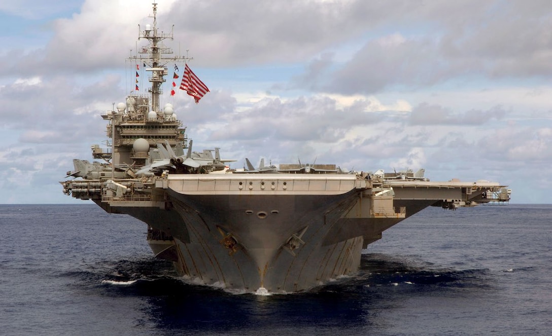 USS Kitty Hawk (CV 63) steams in formation during a joint photo exercise during exercise Valiant Shield 2007 while at sea, August 14, 2007