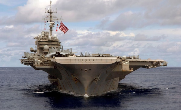 USS Kitty Hawk (CV 63) steams in formation during a joint photo exercise during exercise Valiant Shield 2007 while at sea, August 14, 2007. (U.S. Navy/Mass Communication Specialist Seaman Stephen W. Rowe)
