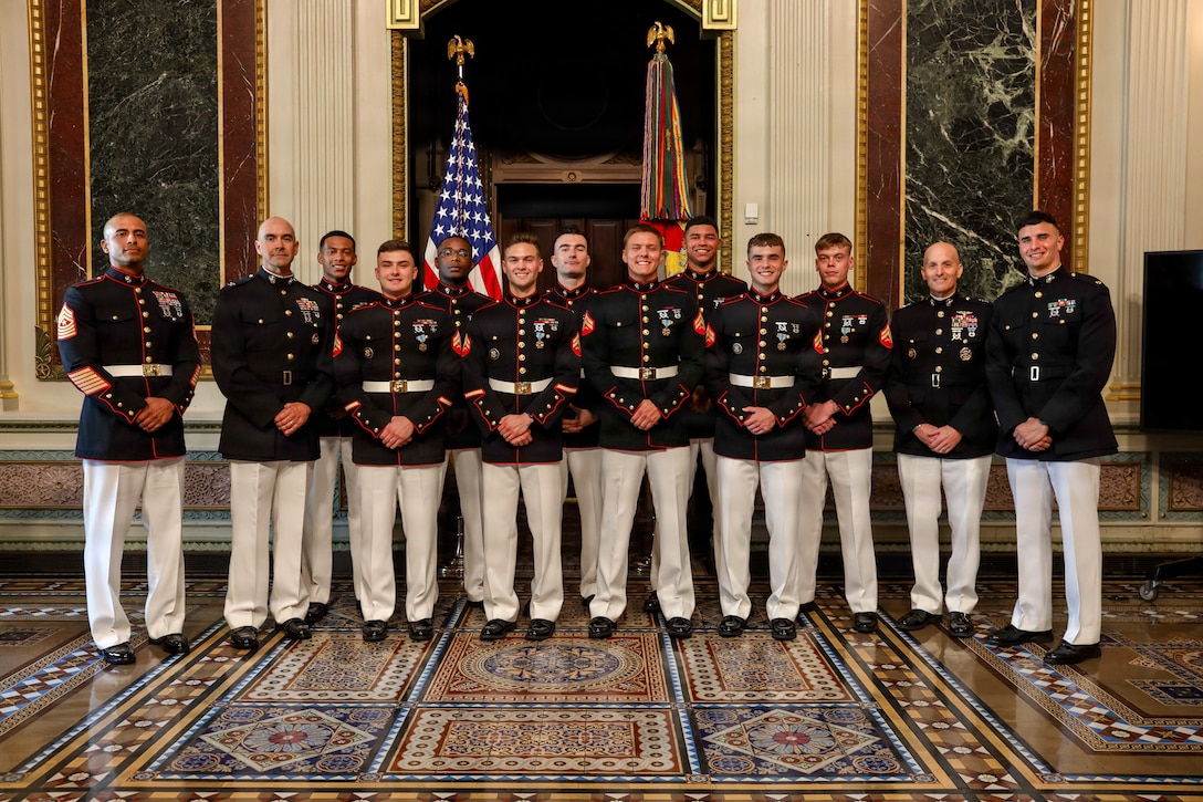 U.S. Marines who serve as White House sentries assigned to Guard Company, Marine Barracks Washington, pose for a photo after receiving Joint Service Achievement Medals during an awards ceremony in the Indian Treaty Room of the Eisenhower Executive Office Building, Washington, D.C., Sept. 10, 2026. Maj. Gen. Garrett Hoffman, director of the White House Military Office, presented nine White House sentries assigned to Guard Company, Marine Barracks Washington, Joint Service Achievement Medals for their professionalism, precision and dedication while providing ceremonial support during the April 2026 State Visit of King Charles III and Queen Camilla. Whether standing post, supporting the President or representing the Marine Corps before audiences from around the world, Barracks Marines remain ready to uphold the standard wherever they are called to serve. (U.S. Marine Corps photo by Lance Cpl. Landon Heredia)