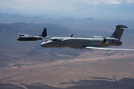 An EC-130H Compass Call and an EA-37B Compass Call assigned to the 55th Electronic Combat Group fly in formation over southern Arizona, Sept. 3, 2026. The EA-37B is replacing the EC-130H, modernizing the Air Force’s airborne electromagnetic warfare capability. (U.S. Air Force photo by Senior Airman Devlin Bishop)