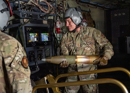Chief Master Seargeant of the Air Force David R. Wolfe loads a 105 mm high-explosive round aboard an AC-130J Ghostrider over the Eglin Range Complex, Fla., Sept. 2, 2026. Wolfe and Air Force Chief of Staff Gen. Ken Wilsbach observed live-fire operations during a capabilities demonstration highlighting the aircraft's close air support, air interdiction, and armed reconnaissance capabilities. (U.S. Air Force photo by Senior Airman Isabel Tanner)
