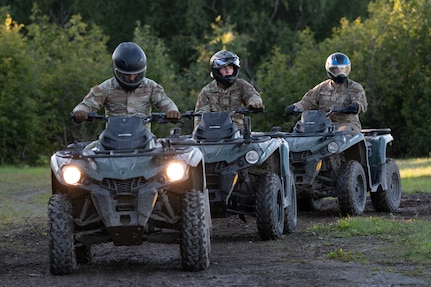 Airman 1st Class Adam Fernandez, Airman Levi Ruyle and Staff Sgt. Ethan Farmer, 673rd Security Forces Squadron defenders, ride all-terrain vehicles during Alaska Defense Sustainment Training at Joint Base Elmendorf-Richardson, Alaska, Aug. 31, 2026. The 673rd SFS conducted training to build tactical off-road mobility and vehicle-handling capabilities across rugged terrain. (U.S. Air Force photo by Airman 1st Class Frank Houseton)