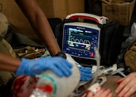 A U.S. Air Force medic assigned to the 31st Air Task Force monitors vitals during a mass casualty exercise at Hurlburt Field, Florida, Aug. 4, 2026. The training program, designed by the 1st Special Operations Medical Group and the 31st ATF equips Airmen with the skills needed to operate effectively in austere and unpredictable environments. (U.S. Air Force photo by Senior Airman Isabel Tanner)