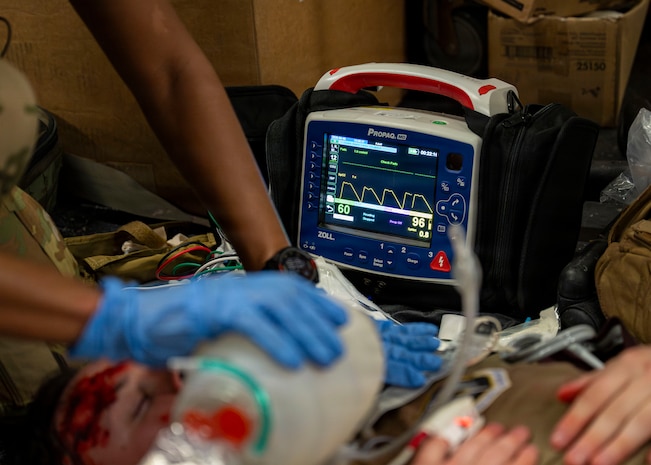 A U.S. Air Force medic assigned to the 31st Air Task Force monitors vitals during a mass casualty exercise at Hurlburt Field, Florida, Aug. 4, 2026. The training program, designed by the 1st Special Operations Medical Group and the 31st ATF equips Airmen with the skills needed to operate effectively in austere and unpredictable environments. (U.S. Air Force photo by Senior Airman Isabel Tanner)