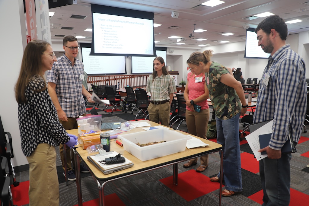 Attendees learn more about environmental DNA (eDNA) during the workshop’s group learning sessions at ERDC's Construction Engineering Research Laboratory (CERL).