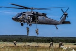 U.S. tactical air control party (TACP) Airmen with Detachment 2, 6th Combat Training Squadron, Nellis Air force Base, Nevada, fast rope from a Sikorsky UH-60 Black Hawk during training at Joint Base San Antonio-Camp Bullis, Texas, Aug. 20, 2026. TACP Airmen are highly trained experts that go through intense physical, mental and technical training in order to withstand the demanding conditions of battle and provide their team with the firepower they need for continued success on the battlefield. (U.S. Air Force photo by Melissa Hydrick)