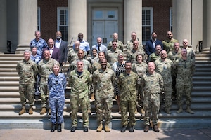Logisticians from five partner nations pose for a group photo.