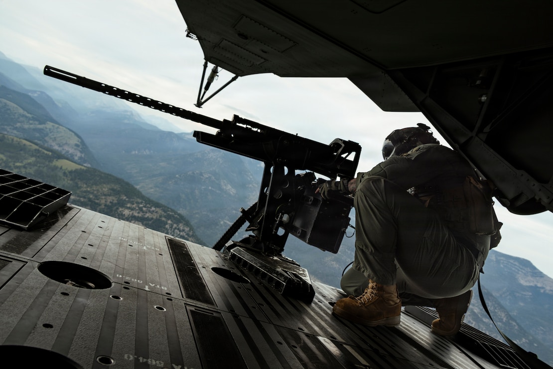 U.S. Marine Corps Staff Sgt. Kevin Baker, from Ohio, a crew chief with Marine Heavy Helicopter Squadron (HMH) 461, Marine Aircraft Group 29, 2nd Marine Aircraft Wing, looks out the back of a CH-53K King Stallion during a Marine Corps Combat Readiness Evaluation near Helena, Montana, July 20, 2026.