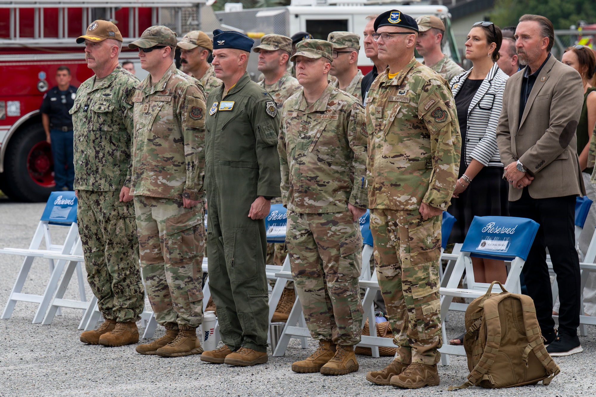 A photo of Joint Base Lindsey Graham leadership standing during the national anthem.