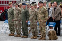 A photo of Joint Base Lindsey Graham leadership standing during the national anthem.
