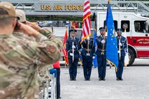 A photo of service members honoring the national anthem during a 09/11 Remembrance Ceremony.