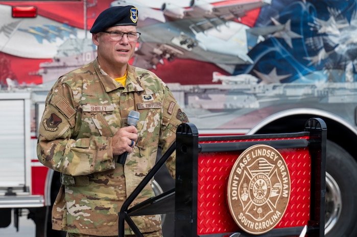 A photo of a service member delivering a speech during a 09/11 Remembrance Ceremony.