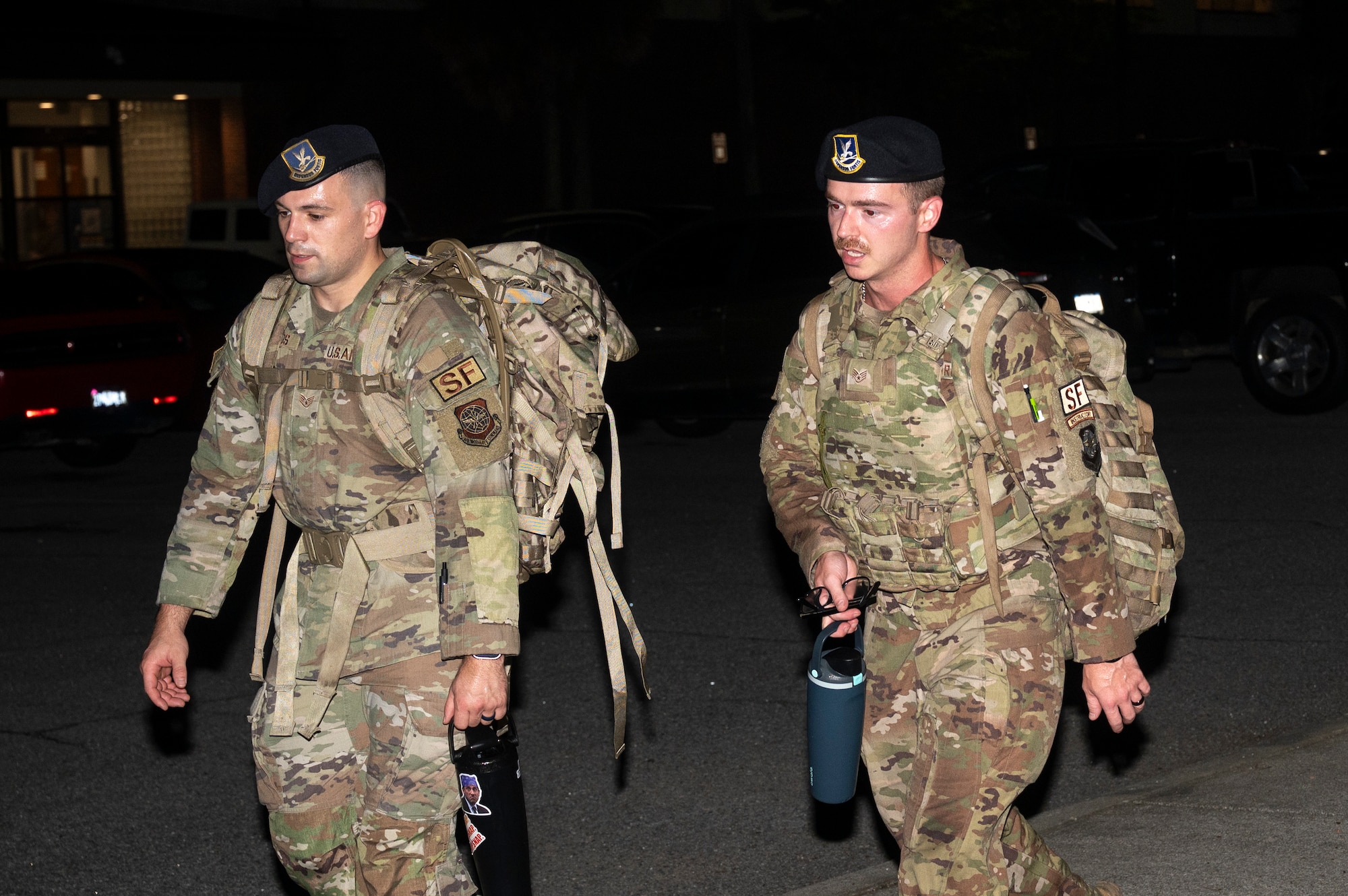 A photo of service members participating in a ruck march.