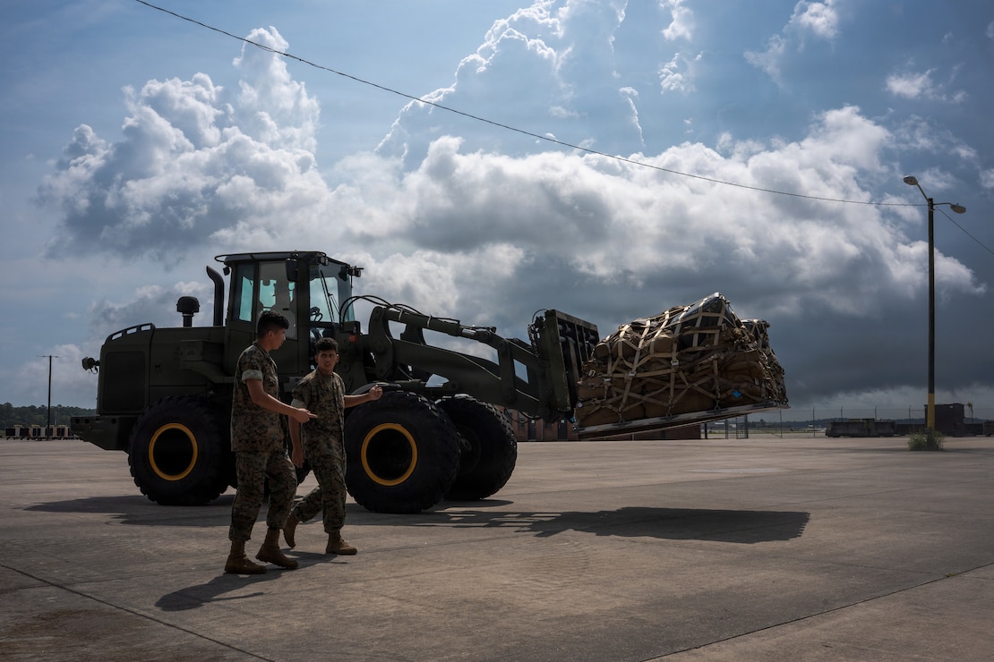 U.S. Marines with Combat Logistics Company 21, 2nd Maintenance Battalion, 2nd Combat Readiness Regiment, in support of Littoral Combat Force 24, prepare to load equipment onto a KC-130J Super Hercules with Marine Aerial Refueler Transport Squadron (VMGR) 252, Marine Aircraft Group 14, 2nd Marine Aircraft Wing at Marine Corps Air Station Cherry Point, North Carolina, June 27, 2026.