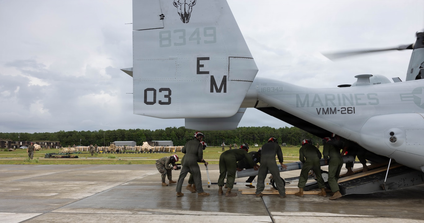 U.S. Marines with Marine Fighter Attack Squadron (VMFA) 231 and VMFA-542, Marine Aircraft Group 14, 2nd Marine Aircraft Wing, unload ordnance from an MV-22B Osprey with Marine Medium Tiltrotor Squadron (VMM) 261, MAG-26, 2nd MAW during exercise Atlantic Lightning 26-2 at Davis Airfield, North Carolina, July 21, 2026.