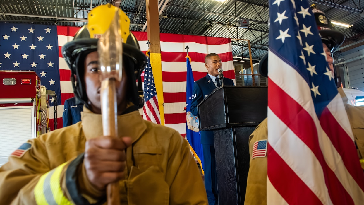 Airman sings the national anthem