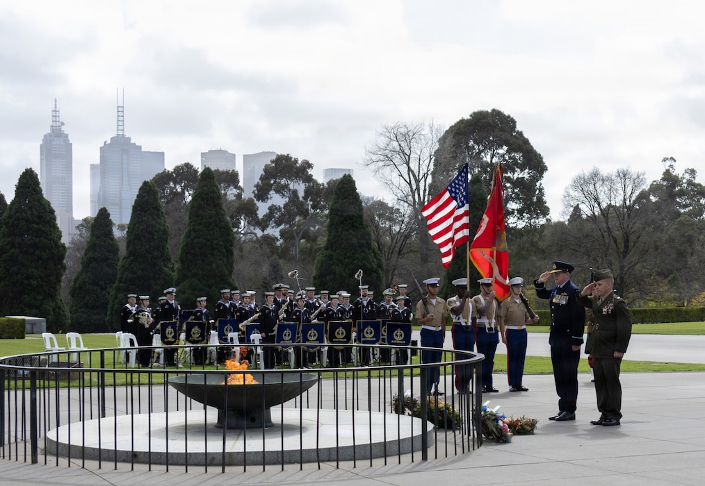 U.S. Marine Corps Col. George Flynn, the commanding officer of Marine Rotational Force – Darwin 26, and a Royal Australian Air Force officer salute after laying wreaths before the Eternal Flame during a 9/11 memorial service at the Shrine of Remembrance in Melbourne, Australia, Sept. 10, 2026.
