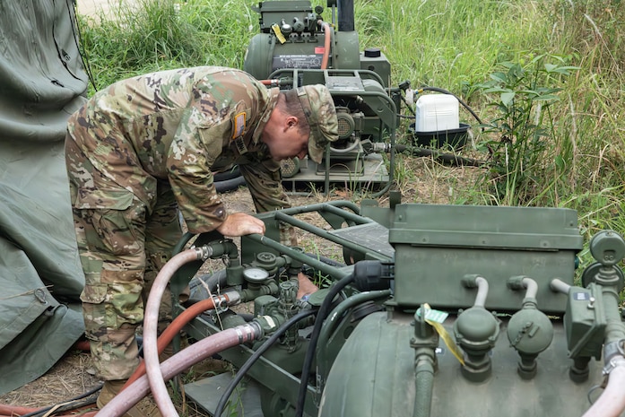 Staff Sgt. Adam Greenman, 1013th Quartermaster Company, performs preventative maintenance on an Army 12-head shower system at the Baturaja Combat Training Center, Indonesia, during Super Garuda Shield 26, Sept. 10, 2026.