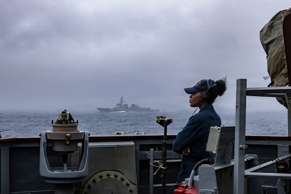 U.S. Navy Boatswain’s Mate Seaman Alexander Carabajal stands watch on the starboard bridge wing aboard Arleigh Burke-class guided-missile destroyer USS Benfold (DDG 65) while Republic of Korea Navy Sejong the Great-class guided-missile destroyer ROKS Yulgok Yi I (DDG 992) steams alongside during a maritime maneuvering exercise with Republic of Korea Navy and Japan Maritime Self Defense Force in the Western Pacific Ocean, Sept. 10, 2026, in support of Freedom Edge 26.