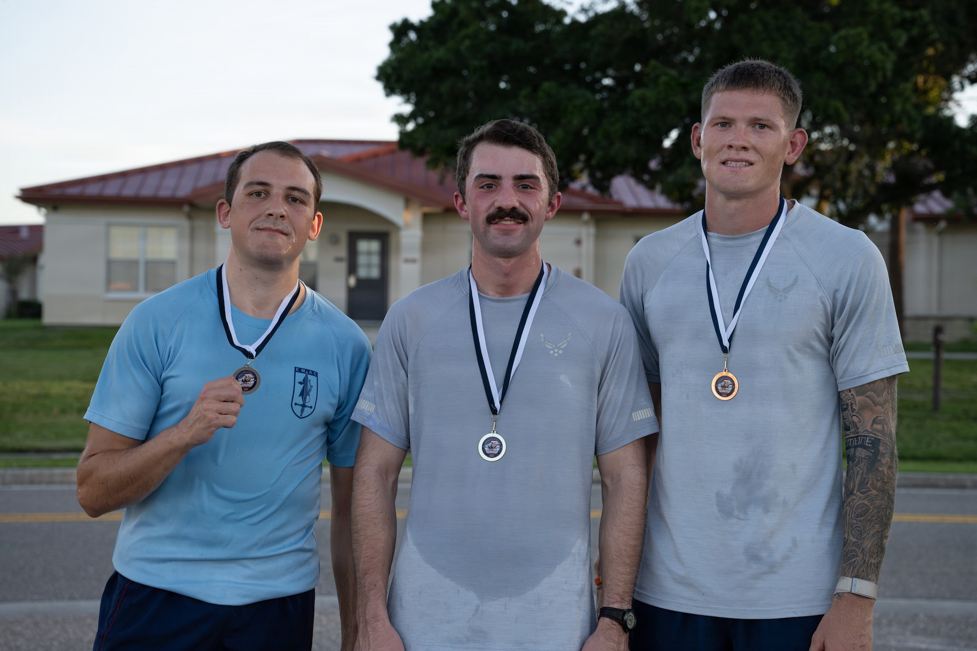 First, second and third place runners pose for a picture during the Rhino Memorial 5K at MacDill Air Force Base, Florida, Aug. 31, 2026. The memorial run strengthens camaraderie among Airmen while preserving the legacy of fallen Vehicle Operations and Ground Transportation Airmen. (U.S. Air Force photo by Airman 1st Class Helen Ly)