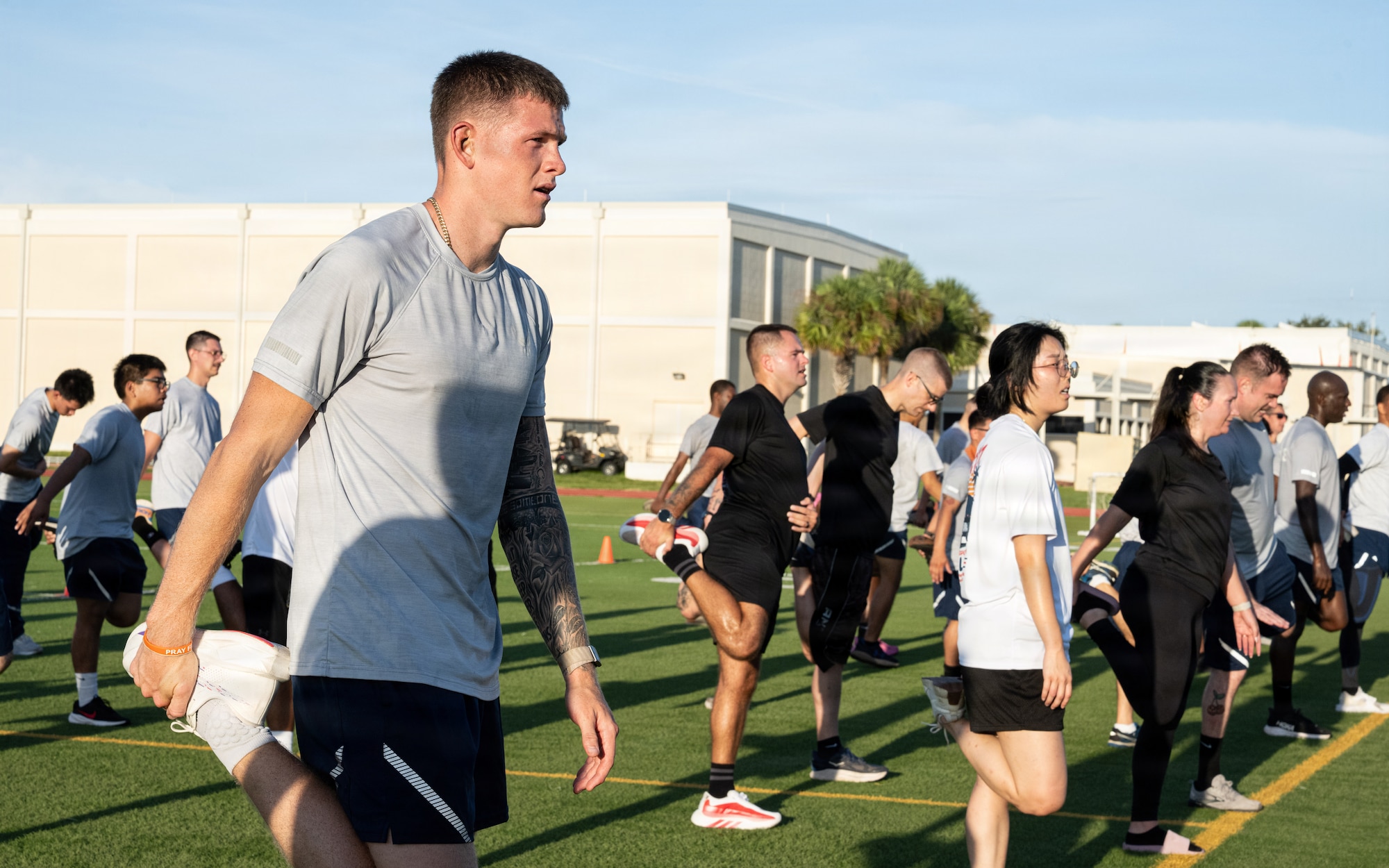 U.S. Air Force Airman 1st Class Liam Kelly, 6th Logistic Readiness Squadron logistics planner, stretches after the Rhino Memorial 5K at MacDill Air Force Base, Florida, Aug. 31, 2026. The annual event honors U.S. Air Force Vehicle Operations and Ground Transportation Airmen, known as “Rhinos,” who made the ultimate sacrifice in the line of duty. (U.S. Air Force photo by Airman 1st Class Helen Ly)