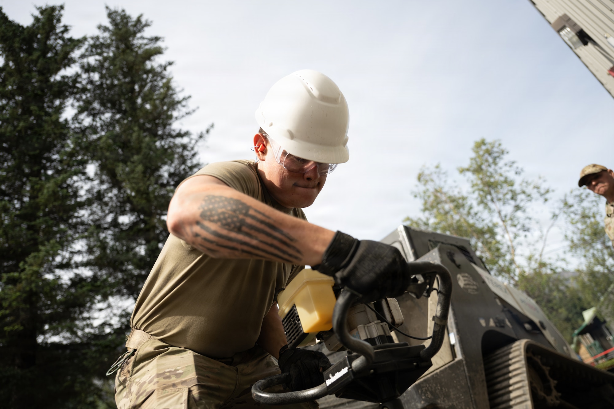 U.S. Airmen assigned to the 163d Civil Engineer Squadron, California Air National Guard, perform upgrade projects during a deployment for training (DFT) at Seward Military Resort in Seward, Alaska, Aug. 10-24, 2026. Thirty-nine Airmen across seven Air Force Specialty Codes participated in the fifth and final rotation of Civil Engineer units from across the country, conducting trenching, metal wrapping, electrical work, concrete placement and roofing across four structures. The DFT allows Airmen to upgrade the Morale, Welfare and Recreation facility while completing training requirements that prepare them to perform their duties in overseas and deployed environments. (U.S. Air National Guard photo by Tech. Sgt. Pagan)