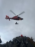 An aircrew from the U.S. Coast Guard Air Station North Bend hoists and injured hiker from a lava field near North Sister, Oregon, Saturday, Sept. 5, 2026.
