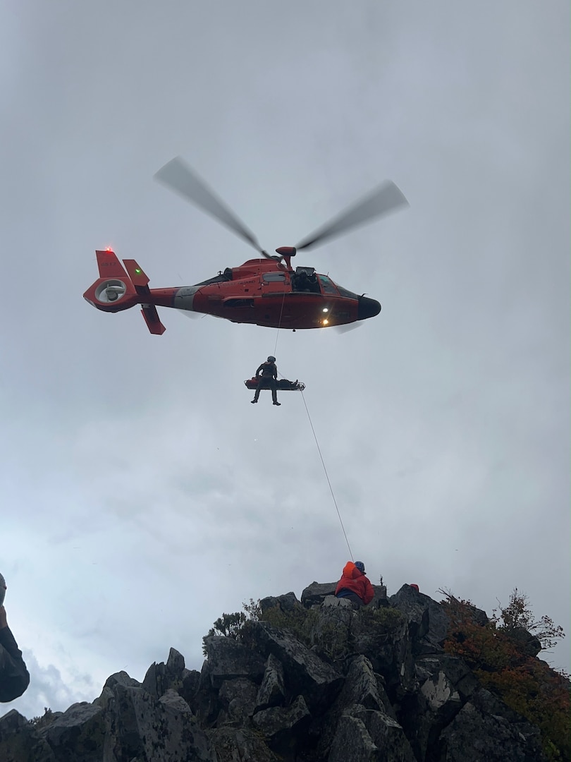 An aircrew from the U.S. Coast Guard Air Station North Bend hoists and injured hiker from a lava field near North Sister, Oregon, Saturday, Sept. 5, 2026.