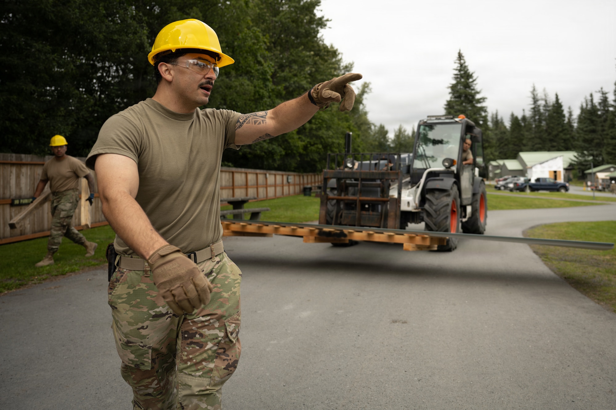 U.S. Airmen assigned to the 163d Civil Engineer Squadron, California Air National Guard, perform upgrade projects during a deployment for training (DFT) at Seward Military Resort in Seward, Alaska, Aug. 10-24, 2026. Thirty-nine Airmen across seven Air Force Specialty Codes participated in the fifth and final rotation of Civil Engineer units from across the country, conducting trenching, metal wrapping, electrical work, concrete placement and roofing across four structures. The DFT allows Airmen to upgrade the Morale, Welfare and Recreation facility while completing training requirements that prepare them to perform their duties in overseas and deployed environments. (U.S. Air National Guard photo by Tech. Sgt. Pagan)