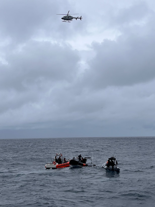 A Coast Guard Cutter Robert Ward (WPC 1130) 26-foot Over The Horizon cutter boat crew pauses during a maritime enforcement scenario with two Ecuadorian Navy boatcrews offshore the Galapagos Islands Aug. 23, 2026. The U.S. Coast Guard participated in Galapex, a multinational maritime military exercise led by the Ecuadorian Navy to combat illegal fishing and improve regional naval cooperation. (U.S. Coast Guard courtesy photo)