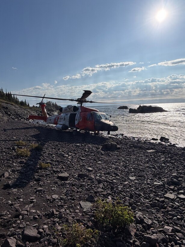 A U.S. Coast Guard Air Station Traverse City MH-60 Jayhawk helicopter rests ashore the beach of Isle Royale National Park in Michigan Sept. 12, 2026. The helicopter crew assisted state and local agencies to search and rescue a man who went missing on the island days prior. (U.S. Coast Guard Courtesy photo by Air Station Traverse City)