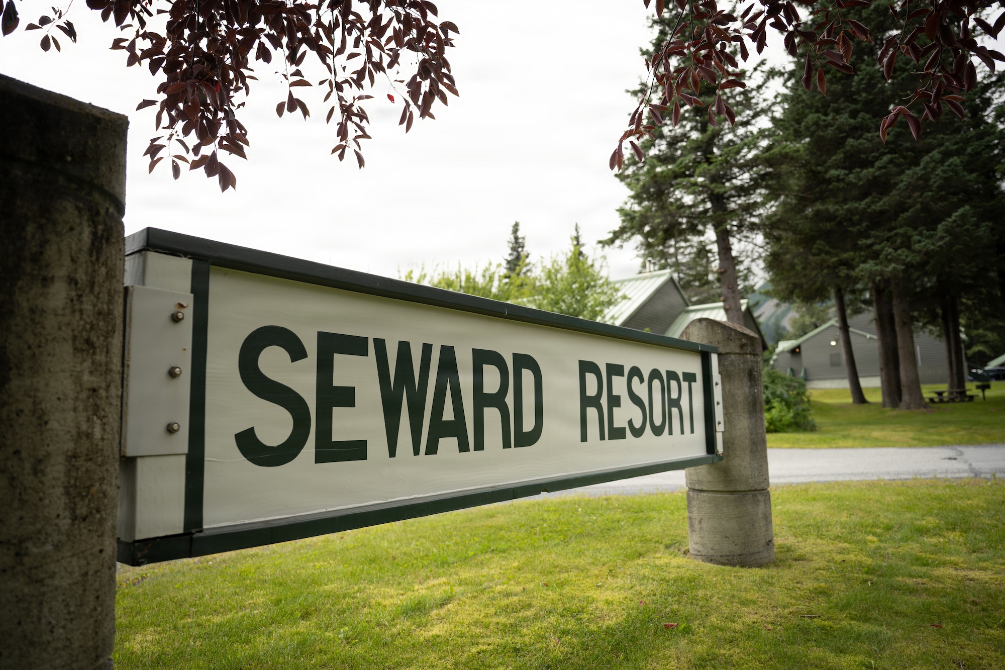 A sign marks the entrance to Seward Military Resort in Seward, Alaska, Aug. 20, 2026. U.S. Airmen assigned to the 163d Civil Engineer Squadron, California Air National Guard, performed upgrade projects during a deployment for training (DFT) at Seward Military Resort in Seward, Alaska, Aug. 10-24, 2026. Thirty-nine Airmen across seven Air Force Specialty Codes participated in the fifth and final rotation of Civil Engineer units from across the country, conducting trenching, metal wrapping, electrical work, concrete placement and roofing across four structures. The DFT allows Airmen to upgrade the Morale, Welfare and Recreation facility while completing training requirements that prepare them to perform their duties in overseas and deployed environments. (U.S. Air National Guard photo by Tech. Sgt. Pagan)