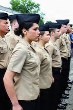 Sailors assigned to Navy Medicine Readiness and Training Command (NMRTC) Patuxent River observe a moment of reflection on the command grounds during a Sept. 11, 2026, morning colors ceremony. Marking 25 years since the terrorist attacks on New York, the Pentagon, and Shanksville, Pennsylvania, the observance included a chronological timeline reading of the day's major events, ensuring younger service members carry forward the history and weight of that morning.