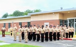 Active-duty personnel stand in formation at Navy Medicine Readiness and Training Command (NMRTC) Patuxent River, led by Commanding Officer Capt. Ken Radford and Executive Officer Capt. Ronald Dewees, during a Sept. 11, 2026, ceremony commemorating the 25th anniversary of 9/11. The observance offered the command an opportunity to pause, reflect on the lives lost, and share the enduring history of Sept. 11, 2001, with a new generation of service members.
