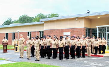 Active-duty personnel stand in formation at Navy Medicine Readiness and Training Command (NMRTC) Patuxent River, led by Commanding Officer Capt. Ken Radford and Executive Officer Capt. Ronald Dewees, during a Sept. 11, 2026, ceremony commemorating the 25th anniversary of 9/11. The observance offered the command an opportunity to pause, reflect on the lives lost, and share the enduring history of Sept. 11, 2001, with a new generation of service members.