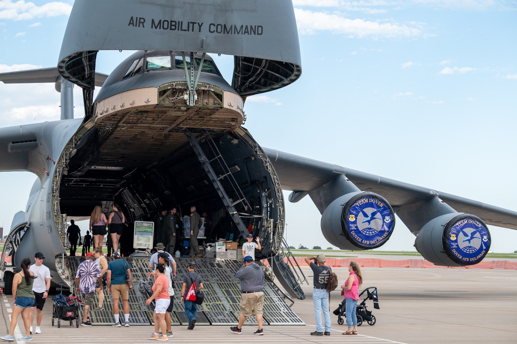 Families tour a A C-5M Super Galaxy Aug. 24 at McConnell Air Force Base, Kansas. The Frontiers in Flight Air Show featured aerial performers and static displays from around the world, as well as military recruiters, the Anheuser-Busch Budweiser Clydesdales, exotic cars, food concessions, souvenir vendors, a Kid Zone and more. Air shows are a way for the Air Force to give back and show their appreciation to the local community, as well as showcase Department of Defense and Air Force capabilities. (U.S. Air Force Photo by Airman 1st Class Gavin Hameed)