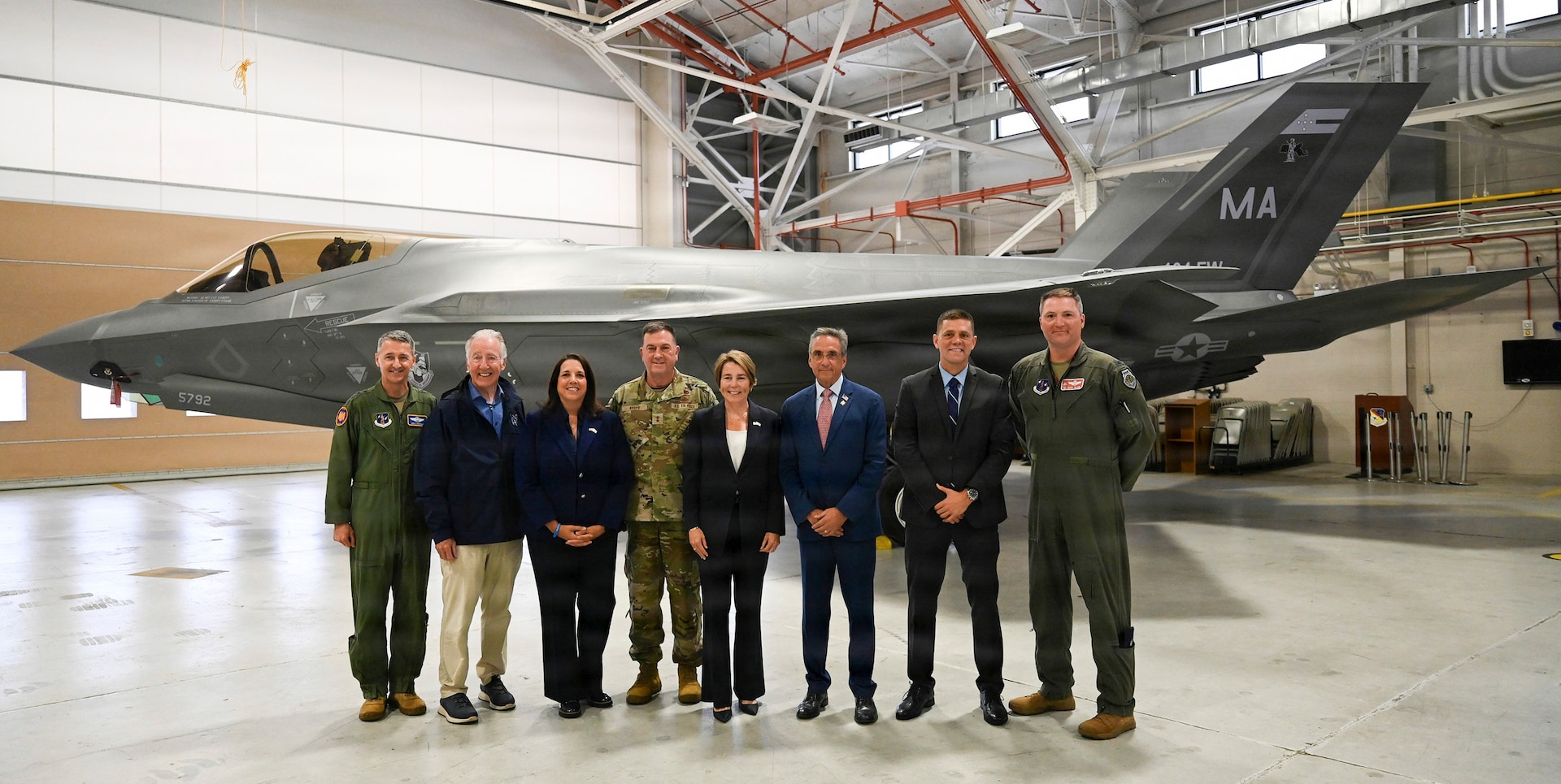 From left to right, U.S. Air Force Gen. Steven Nordhaus, chief of the National Guard Bureau; U.S. Senator Richard Neal of Massachusetts; Massachusetts Lt. Gov. Kim Driscoll; U.S. Air Force Maj. Gen. Gary W. Keefe, adjutant general of the Massachusetts National Guard; Massachusetts Gov. Maura Healy; Westfield Mayor Michael McCabe; U.S. Army Maj. John Velis, Massachusetts senator for Hampden and Hampshire districts; and U.S. Air Force Col. Michael 'Shot' Glass, commander of the 104th Fighter Wing, pose for a group photo in front of an F-35A Lightning II multi-role fighter aircraft during a ceremony at Barnes Air National Guard Base, Westfield, Massachusetts, Sept. 13 2026.